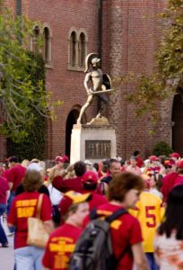 Students wearing cardinal and gold T-shirts gathered on the USC campus.