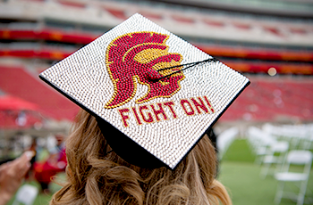 commencement cap with Trojans and fight on