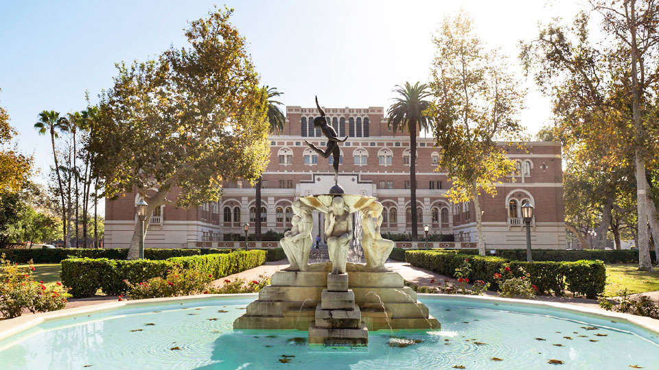 Youth Triumphant Fountain in front of a USC Doheney Library