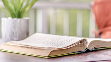 reading a book in the patio